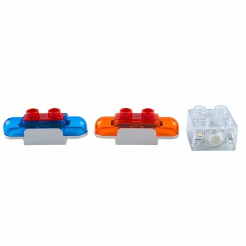 Drie LEGO lichtblokken in verschillende kleuren.